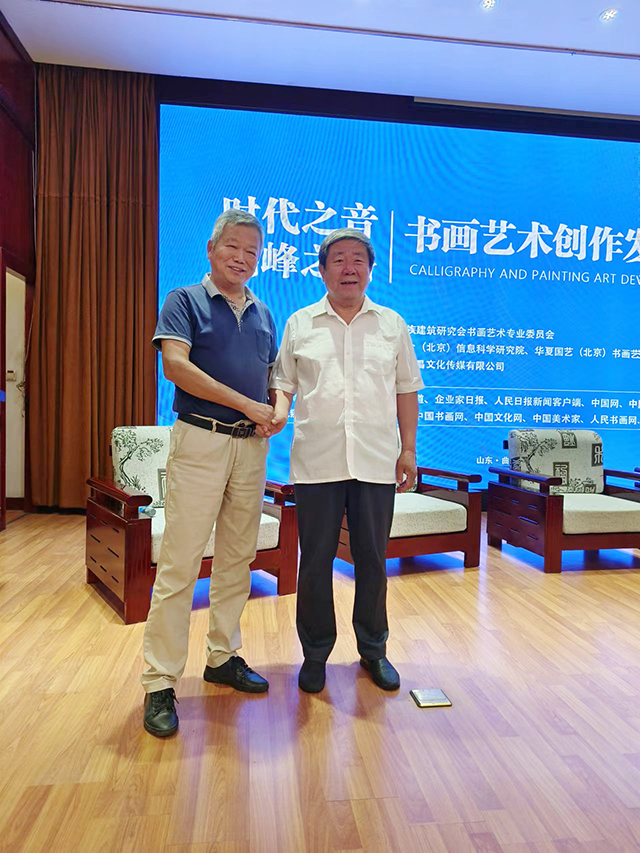 上海市高等教育学会文化艺术教育专业委员会主任杨福才与国家文物局原党组书记、副局长张柏合影.jpg