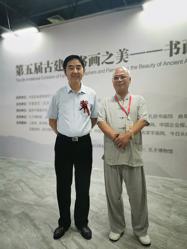 央广文旅发展中心副理事长、中国楹联学会书法艺术研究会常务理事林文亮 与中国文联原办公厅主任、中国民族建筑研究会书画艺术专业委员会主任罗杨合影.jpg